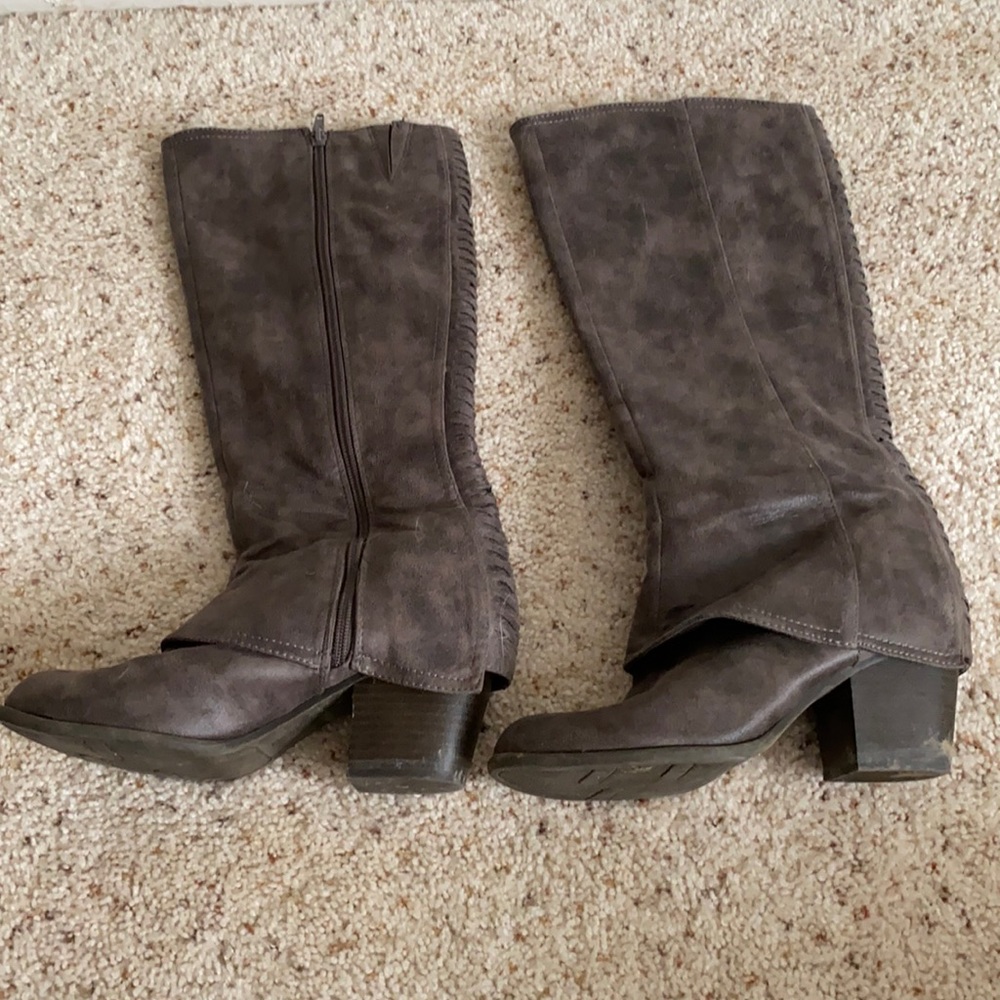 Knee high fergalicious boots with braided detail on the back.